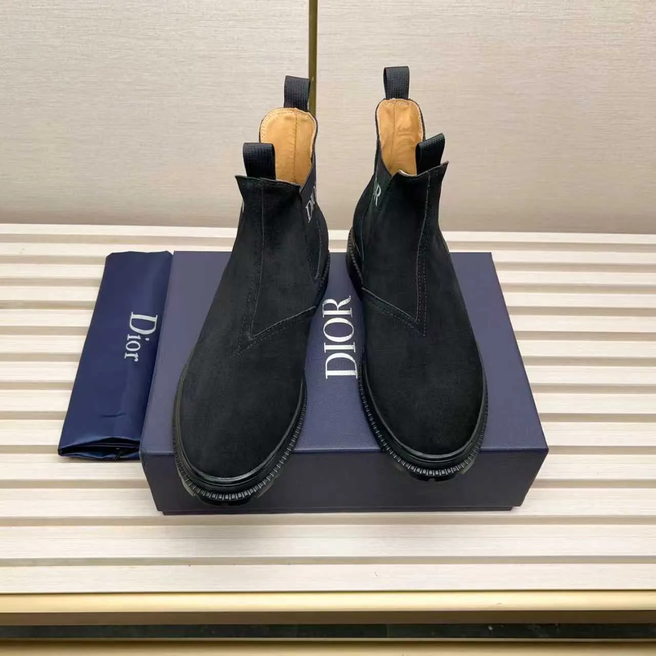 Men's Shoes 💰480 Dior A practical choice that combines protection with classic style. Made from durable Rugged Calf leather, it's tumbled and hand-finished to create a soft suede feel with a rich texture. Elastic side panels and subtle cutouts are inspired by the classic Chelsea boot. Leather upper and lining with Kummel tabs at front and rear, rubber outsole